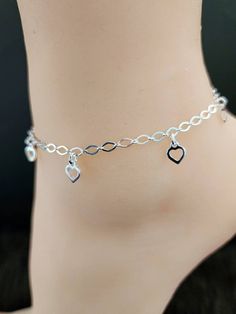 925 Sterling Silver Plain Heart Charm Ankle-Bracelet Real 925 Sterling Silver NOT SILVER PLATED High Quality Silver Bracelet   High polished rhodium finish gives this bracelet a stunning shiny look that lasts many years. We have hundreds Silver Jewelry in stock. If you don't see what you are looking , feel free to ask us.   Trendy, dainty, luxurious, classic with modern touch, elegant and fancy, fine quality made   925 Sterling Silver dangling heart anklet-bracelet.  Description 925 Sterling Sil Adjustable Heart Metal Anklets, Adjustable Heart-shaped Metal Anklet, Heart-shaped Metal Anklets For Gift, Heart-shaped Metal Anklets As Gift, Silver Adjustable Heart-shaped Anklets, Silver Dangle Heart Bracelet As Gift, Adjustable Silver Heart Anklets, Silver Anklets With Heart Charm For Valentine's Day, Silver Anklets With Adjustable Chain As Gift