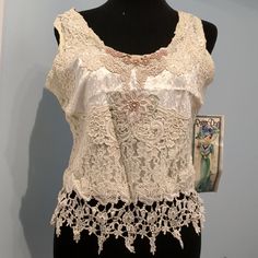 Victorian Style Embroidered Lace Pearls Size M Measurements On Model Armpit To Armpit 17" Length 20" White Lace Patchwork Cotton Top, White Cotton Lace Patchwork Top, White Cotton Lace Top With Patchwork, Summer Cotton Tops With Lace Work, Elegant White Lace Patchwork Tank Top, Cotton Lace Work Tops For Summer, White Sleeveless Blouse With Lace Patchwork, White Vintage Sleeveless Lace Top, White Sleeveless Vintage Lace Top