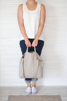 "This natural linen bag is roomy enough for your day's carry, shopping, market, school, college, university, beach, sport, travel, yoga. This shoulder bag is made of softened Baltic natural linen. This linen tote bag is constructed with two different sizes handles. The bag can be or not constructed with a big zippered pocket inside (YKK zipper). ❤ AVAILABLE COLORS: * natural * black ❤ SIZE: * width at top 43 cm (17\") * length 40 cm (16\") ❤ CARE: Hand or machine wash (gentle cycle) in 30-degree Eco-friendly Everyday Bag With Double Handle, Eco-friendly Everyday Shoulder Bag, Eco-friendly Everyday Tote Bag, Eco-friendly Large Capacity Bucket Tote Bag, Eco-friendly Tote Shoulder Bag For Everyday, Eco-friendly Rectangular Shoulder Bag For Everyday Use, Eco-friendly Tote Bag For Everyday Use, Eco-friendly Bag With Top Carry Handle, Everyday Eco-friendly Tote Shoulder Bag