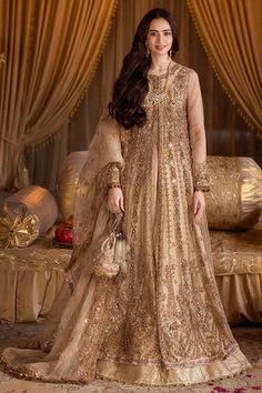 Pakistani Wedding Dress in Gold Open Gown Lehenga Style is a stunning attire adorned with Lavish designs and Hand-crafted embellishments. Custom sizes. Anarkali Hand Embellished Gown For Wedding, Anarkali Wedding Dress Hand Embellished, Eid Wedding Dress Hand Embellished Semi-stitched, Eid Hand Embellished Semi-stitched Wedding Dress, Hand Embellished Floor-length Wedding Gown, Wedding Organza Gown Hand Embellished, Eid Reception Hand-embellished Wedding Dress, Wedding Gown With Hand Embellished Organza, Hand Embellished Wedding Dress For Eid Reception