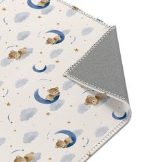 a baby blanket with teddy bears on the moon and stars in the sky above it