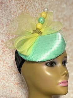 Mint Green Button Fascinator Half Hat perfect for Church Head Covering, Headwear, Tea Parties, Weddings, and other Special Occasions Yellow bows, hat pin and veiling trim this gorgeous piece. The hat pin is for decorative purposes only and may vary. Measurements  Half Hat: 15cm/5.9 inches in diameter  The hat is affixed to the head via a hat string. If you prefer headband instead of hat string, please specify at the time of purchase  Handmade Gifts for mom, sister, wife, or yourself. PLEASE NOTE Mint Green And Yellow, Handmade Gifts For Mom, Sister Wife, Hat Pin, Pill Boxes, Green Button, Tea Parties, Hat Pins, Head Covering