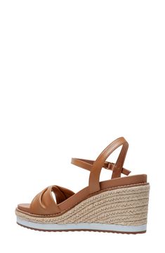 Espadrille-inspired braiding accentuates the wedge heel of this strappy leather sandal. 3 3/4" heel Cushioned footbed Leather upper/synthetic lining/rubber sole Imported Leather Wedge Sandals With Braided Straps For Vacation, Leather Wedge Sandals With Braided Straps For Beach, Leather Wedge Sandals With Braided Straps For Summer, Open Toe Straw Wedge Sandals With Heel Strap, Leather Wedge Sandals With Braided Straps For Spring, Summer Wedge Sandals With Braided Straps, Summer Leather Strappy Wedge Sandals, Brown Wedge Sandals With Ankle Strap And Woven Sole, Summer Strappy Leather Wedge Sandals