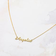 "D E S C R I P T I O N Script Name Necklace * Material: High Quality Solid 925 Sterling Silver * Dimensions: Depending on your font choice, height sizes range from 30 mm to 40 mm lowercase. * Finish: Sterling Silver ∙ 18K Gold ∙ Rose Gold ∙ * All our jewelry is custom made by hand with Love and Care in our workshop * The length option is the TOTAL chain length . If you order an 40 CM plus a 3cm extesnsion\" 1\" extension * All items are nicely packaged ready to gift in elegant jewelry boxes. * I Elegant Name Charm Necklace For Birthday Gift, Customizable Gold Elegant Charm Necklaces, Elegant Nameplate Charm Necklace For Birthday, Elegant Gold Customizable Charm Necklaces, Elegant Customizable Charm Necklaces For Birthday Gift, Elegant Gold Customizable Charm Necklace, Elegant Gold Charm Necklace Customizable, Elegant Birthday Charm Necklace With Custom Name, Classic Nameplate Necklace For Birthday