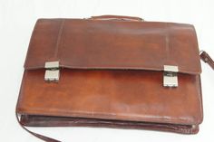 Vintage double combination  lock Tan leather Briefcase  Leather Attaché Leather Messenger Bag with Shoulder belt Great vintage condition  real measurements  WIDTH  40 cm -15,75 INCHES HEIGHT  31 cm - 12,25 INCHES DEPTH  5 cm -  2 INCHES WEIGHT  1,14 kg - 2,51 Lbs Returns & exchanges  If there is a problem with your order, please get in touch with me before leaving negative feedback so we can resolve the issue SHIPPING The order is sent within 1-2 days except on weekends. Orders are sent by Airmail--ships with tracking numbers. After the shipment, I will provide you the tracking number of your package, so you can see where it is and when you will receive it. Formal Leather Briefcase With Hasp Closure, Classic Business Shoulder Bag With Lock, Business Satchel Briefcase With Hasp Closure, Business Briefcase Satchel With Hasp Closure, Classic Business Briefcase With Hasp Closure, Business Briefcase With Hasp Closure And Satchel Shape, Classic Business Satchel With Hasp Closure, Vintage Business Satchel With Hasp Closure, Classic Briefcase With Hasp Closure For Formal Use