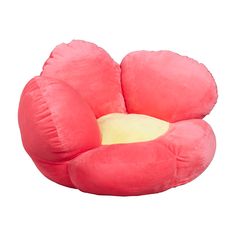 a pink bean bag chair sitting on top of a white floor next to a yellow pillow