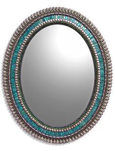 a mirror with beaded trim around it and the words mirrors above it in red