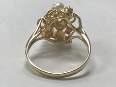 VINTAGE GORGEOUS 14K YELLOW GOLD PEARL AND DIAMOND CLUSTER RING Size 6.25 REALLY STUNNING! Ring features 6 - 3mm pearls and 3 small bright genuine diamonds! Set in solid 14K yellow gold. 2.6 grams Size 6 Please message me with any questions I am open to offers : ) Shipped insured/delivery confirmation I guarantee item to be exactly as described and pictured. Ruby Heart Pendant, Black Opal Pendant, Pearl And Diamond Ring, Heart Pendant Diamond, Initial Ring, Cute Rings, Diamond Cluster Ring, Size 10 Rings, Opal Pendants