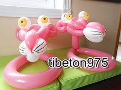 an inflatable pool float with two flamingos on it, and the words tibeton 975 above it