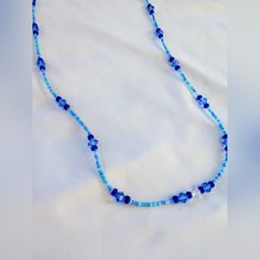 Beautiful Light And Dark Blue Crystal Sparkle Bead Necklace Blue Spacer Beads Jewelry For The Beach, Blue Beaded Necklace With Colorful Beads As Gift, Blue Faceted Beaded Necklaces, Blue Beaded Necklace With Faceted Round Beads, Blue Tiny Beads Necklaces For Beach, Blue Bohemian Beaded Necklace With Faceted Beads, Bohemian Blue Beaded Necklace With Faceted Beads, Blue Beach Necklaces With Tiny Beads, Blue Single Strand Necklace For Beach