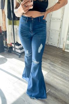 A pair of exaggerated, high-rise flare jeans featuring a front whiskered wash, open distressed knee detail, classic 5-pocket construction, frayed raw hem, and a zip-fly closure.-Rise: 11" Inseam: 33"-True to size Made In: Imported Fabric Contents: 60% Cotton, 32% Modal, 7% T400, 1% Lycra Bell Bottoms, Flare Jeans, High Rise, High Waisted, Stone, Fabric