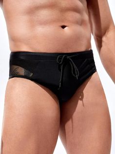 Elevate your beach attire with our Mesh Waist Swim Brief, a must-have addition to your swimwear collection. In classic black, this brief features a plain pattern and an eye-catching contrast mesh detail, adding a modern edge. The medium-stretch fabric ensures a comfortable fit, allowing you to enjoy your time in the water. Features: Color: Black Pattern Type: Plain Details: Contrast Mesh Type: Briefs Fabric: Medium Stretch Material: Fabric Care Instructions: Hand wash, do not dry clean Size Char Black Nylon Swim Trunks For Poolside, Black Beachwear Swim Trunks For Pool, Summer Mesh Bottoms With Mesh Back, Summer Nylon Bottoms With Mesh Back, Black Nylon Swim Trunks For Swimming, Black Nylon Swim Trunks For Beach Season, Black Beachwear Swim Trunks For Surfing, Black Nylon Tie-side Swimwear, Black Tie-side Nylon Swimwear