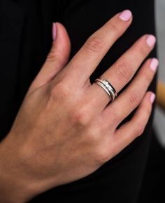 Textured and polished, this beautiful Spinner ring in solid gold or silver has an ancient world feel. This ring exudes the ethos of our small Northumberland brand aspiring to create jewellery with an eye for detail, beauty and history. A beautiful time-less piece that displays true artisan workmanship. HAMMERED GOLD SPINNER RING DETAILS Available in Sterling Silver, 9ct or 18ct Yellow Gold All raw materials/gemstones are ethically sourced. This ring will be hallmarked at the Edinburgh Assay Offi Hammered Open Ring For Promise, White Gold Wide Band Stackable Promise Rings, Stackable White Gold Rings With Wide Band, Sterling Silver Promise Ring With Wide Band, White Gold Stackable Rings With Polished Finish, Stackable Wide Band Rings For Anniversary, White Gold Stackable Wide Band Rings For Wedding, Stackable Anniversary Rings With Wide Band, Wedding Stackable Wide Band Rings In White Gold