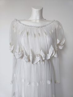 Not sure when it was made, looks like 90s. Very good condition. Lovely lace and ornaments on it.  Measurement taken flat and doubled. bust 80 cm waist 67 cm lenght 144 cm White Fairycore Dress With Lace Trim, Delicate White Party Dress, White Feminine Vintage Dress For Summer, White Feminine Lace For Spring, White Lace Dress With Lace Top, Fairycore Lace Dress For Garden Party, White Vintage Summer Party Dress, White Lace Dress With Lace Collar, White Lace Dress With Lace Collar For Party