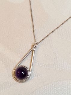 Vintage Amethyst & sterling silver necklace. A long teardrop shaped pendant with a large smooth amethyst, on a 17 inch Italian silver chain. Elegant Teardrop Drop Necklace Nickel Free, Elegant Teardrop Nickel Free Drop Necklace, Sterling Silver Drop Necklace With Large Pendant, Silver Drop Amethyst Jewelry, Silver Amethyst Drop Jewelry, Sterling Silver Drop Necklace Nickel Free, Sterling Silver Teardrop Necklace With Polished Finish, Silver Gemstone Necklaces, Teardrop Sterling Silver Necklace With Polished Finish