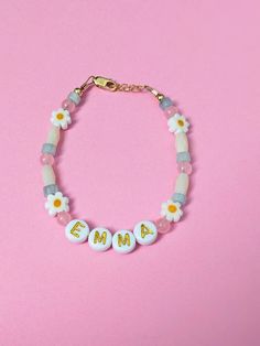 🌼Beautiful custom name or accent bracelets in a few color options!  🌼 Daisies and amazing quality beads with 14k gold filled clasps that won't tarnish. 🤍Perfect for summer bracelets for babies, young girls and Mamas! 🤍 Extender chain of 1/2 inch.  🤍Perfect baby gift, birthday gift, shower gift, or baby announcement!  🤍All bracelets come packaged and ready to gift.  🤍 Please message me for any questions or custom instructions.  Custom NAME clasp bracelets can be exchanged, but it's a $5 fee if it's your mistake (sizing, spelling). It's free if it's MY mistake of course. Refunds on customs are acceptable except a $5 cost to cover the gold pieces. Cute Beaded Jewelry For Personalized Gift, Cute Personalized Beaded Jewelry, Dainty Flower Shaped Personalized Bracelets, Cute Beaded Name Bracelet As Personalized Gift, Cute Personalized Friendship Bracelets With Round Beads, Adjustable Letter Beads Jewelry For Spring, Personalized Flower Jewelry For Friendship, Personalized Flower-shaped Jewelry For Friendship, Personalized Flower Shaped Friendship Jewelry