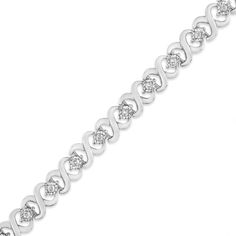 Dress up your everyday look with this classic infinity link diamond tennis bracelet. This piece is crafted from .925 sterling silver, a metal that will stay tarnish free for years to come. Boasting a design of silver "X" links, a miracle-plated round-cut diamond is brilliantly embellished between each link for added glamour. The bracelet has a total carat weight of 1/3 c.t., making it the perfect addition to your growing jewelry collection! Silver Tennis Bracelet With Solid Link Construction, Infinity Diamond Bracelet For Anniversary, Diamond Infinity Bracelet For Anniversary, Classic Infinity Bracelet For Formal Occasions, Infinity Diamond Bracelet With Accents For Anniversary, Silver Infinity Diamond Bracelet For Anniversary, Diamond Infinity Bracelets For Anniversary, Anniversary Diamond Bracelet With Infinity Design, Formal White Gold Infinity Diamond Bracelet