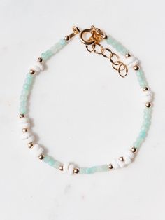 Dotted with natural white puka shells, shimmering gemstones, and golden beads, each of these luxe puka shell gemstone bracelets are one of kind. Each exquisite piece captures the essence of paradise, reminiscent of sun-kissed beaches and gentle ocean breezes. ✦ Choose your Gemstone and Adjustable Length ✦ ✦ DETAILS ✦✧ Name: Ke'alohi (kay ah LO hee) - the brightness. .✧ All golden components 14kt Gold Filled.✧ White Puka Shells.✧ Genuine Gemstones.✧ Due to the nature of the gemstones, each piece may vary from the photos in size/color/shape. Every piece is gorgeous and unique.✧ All Ke Aloha Jewelry pieces come packaged thoughtfully, beautifully, and ready for gift giving.✧ Unless otherwise noted in the listing description, all pieces are sold individually. Photos with models/multiple pieces Unique Choker Necklaces, Seashell Bracelet, Hawaii Jewelry, Amazonite Bracelet, Lapis Lazuli Bracelet, Lapis Lazuli Jewelry, Puka Shell, Labradorite Bracelet, Seashell Jewelry