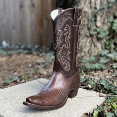 These premium taylor Teju boot is is exploding with elegance Premium chocolate Teju Lizard foot 12” calf top with tan amd brown fancy stitch Leather snip toe 1 3/8” walking heel Hand lasted with lemon wood pegging Made in Texas Western Brown Goodyear Welted Chelsea Boots, Western Style Brown Chelsea Boots With Goodyear Welt, Western Style Brown Goodyear Welted Chelsea Boots, Brown Goodyear Welted Western Chelsea Boots, Fitted Brown Chelsea Boots With Leather Sole, Brown Leather Sole Mid-calf Boots With Almond Toe, Fitted Brown Chelsea Ankle Boots, Brown Mid-calf Boots With Almond Toe And Leather Sole, Brown Almond Toe Mid-calf Boots With Leather Sole