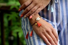 Bright and boho, our handmade hematite beaded bracelets provide the perfect amount of sparkle to look just as pretty with cutoffs and tanks as they do with sundresses! Features: Handwoven of satin threads with a beautiful sheen A sparkly natural hematite stone band Shell accent with satin thread tassels Adjustable sizing - 10.5 inches to first knot, total length 16.5 inches. Bohemian Bracelets For Spring, Bohemian Beaded Bracelets For Spring Vacation, Bohemian Beaded Friendship Bracelets For Summer, Bohemian Beaded Bracelets For Spring Beach, Bohemian Beaded Bracelets For Beach In Spring, Spring Bohemian Beaded Friendship Bracelets, Bohemian Friendship Bracelets For Spring Vacation, Handmade Bohemian Friendship Bracelets For Spring, Adjustable Beaded Bracelets With Tassels For Beach