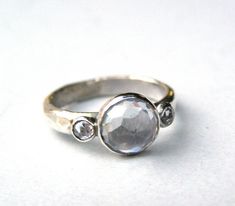 a close up of a ring on a white surface