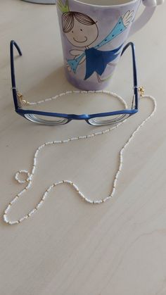 "You can always wear it easily. You can use it not only as eyeglass chain, but also as a necklace and bracelet with white color. Measures approx. 30\" (75 cm) total length Sunglasses necklace will be a perfect gift for yourself and your loved ones. The price is for 1 piece of eyeglass . I can make it in any color you want. Please contact me. Thank you for visiting my store." Beaded Eyeglass Chain, Eyeglasses Chain, Chain Sunglasses, Sunglasses Necklace, Sunglasses Chain, Sunglass Chain, Eyeglass Chain, Glasses Chain, Necklace And Bracelet