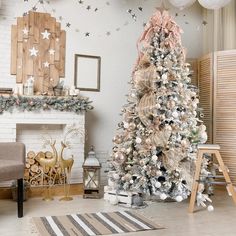 a decorated christmas tree in the corner of a living room with white and gold decorations