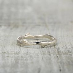 This simple and rustic twig ring is a perfect choice for any nature lover!  The twig band is available in solid 14K white gold, yellow gold, rose gold, palladium or platinum. Made to order, this ring is my original design and ships in 1 to 2 weeks. Sizes 4 to 15. Please don't hesitate to contact me with any questions, because I want you to love this ring! Handmade in the USA 🇺🇸I take a lot of pride in my work and I know how important this purchase is to you. Therefore before ordering or at any Nature-inspired White Gold Wedding Rings, Nature-inspired Polished Jewelry For Anniversary, Nature-inspired Sterling Silver Wedding Rings, Nature-inspired Sterling Silver Wedding Jewelry, Nature-inspired Engraved Wedding Rings, Nature-inspired Hammered Jewelry For Anniversary, Heirloom Hammered Wedding Jewelry, Branch Wedding Band, Tree Branch Wedding