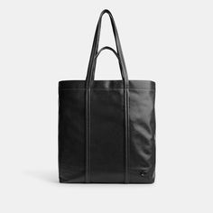 Our Hall is made for doing it all (just like you). Crafted of our pliable lightest weight leather with a soft feel this open top carryall has a durable fabric lining a zip pocket to keep essentials secure and space for a 16 laptop. Finished with our Signature hardware it features both slim shoulder straps and top handles for versatile wear. (Tote it your way.) | Coach Hall Tote Bag - Black Soft Leather Tote Laptop Bag For Travel, Coach Leather Handle Tote Bag, Coach Shoulder Bag With Large Capacity In Coated Canvas, Modern Coach Bags In Coated Canvas, Coach Tote Bag With Leather Handles, Coach Shoulder Bag With Large Capacity, Coach Large Capacity Coated Canvas Shoulder Bag, Large Capacity Coach Shoulder Bag In Coated Canvas, Modern Large Bag With Top Carry Handle