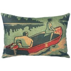 a decorative pillow with two people in a boat on the water and trees behind it