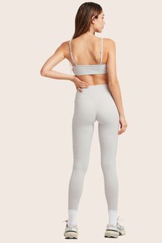 Experience style and comfort with the 2024 FormCloud™ Leggings in Heather Grey. These high-waisted leggings offer a smooth texture, medium compression, and are made from our proprietary FormCloud™ fabric. With no side or front seams, they provide a sleek look for your active pursuits. Seamless 4-way Stretch Leggings For Loungewear, Gray Elastane Leggings For Loungewear, Versatile Compression Tights With Light Support, Gray Fitted Activewear, Bra Friendly, Functional Seamless Gray Bottoms, Functional Gray Seamless Bottoms, Gray Elastane Activewear For Loungewear, Gray High Waist Yoga Pants, Gray Compression Leggings With Seamless Construction