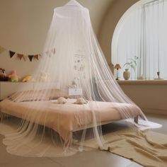 a bed with a mosquito net over it