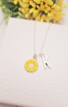 It's more than charm, it's a Sunflower necklace This Cute Sunflower chain necklace comes with a Gold Sunflower charm and a choice of sterling silver chain or gold chain. You can get these personalized necklaces in any length, so please contact me via Etsy Conversations if you need any size. This minimalist and dainty celestial necklace is made with a high-quality material that is eco-friendly, durable, and anti-inflammatory. It won't leave your skin green due to marks. Moreover, the weight of the necklace is quite appropriate, and they come with a Lobster Clasp to provide you a full-day comfort without any hassle. This adult necklace makes the perfect gift for your loved ones on special occasions like anniversaries, bridal showers, engagements, and graduation parties. Sterling Silver Charm Necklace With Flower For Mother's Day, Mother's Day Jewelry With Flower Charm Initial Pendant, Mother's Day Sterling Silver Necklace With Flower Charm, Mother's Day Flower Charm Necklace With Initial Pendant, Mother's Day Charm Necklace With Initial Pendant Flower Charm, Mother's Day Charm Necklace With Flower And Initial Pendant, Mother's Day Flower Charm Initial Pendant Necklace, Dainty Necklace With Initial Pendant And Flower Charm, Dainty Initial Pendant Necklace With Flower Charm