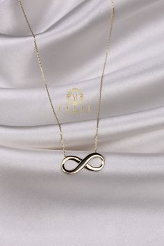 "ABOUT PRODUCT This 14K gold Infinity necklace is beautifully designed and hand crafted with our associates to make this a special gift for your loved ones. Knowing the value of our customers, We prepare each piece with extra care and attention. ITEM DETAILS Material: 14K Gold Approx: 2,85 gr Available colors: Gold, Rose Gold, White Gold Available Sizes: 14\" to 20\" ✪ 14k Solid Gold ( Certification will be included with your order ) ✪Available 14K White, Yellow, Rose Gold (also in 10, 18K) 🛠 Y Minimalist Infinity Jewelry For Formal Occasions, Yellow Gold Infinity Necklace With Adjustable Chain, Formal Infinity Necklace With Adjustable Chain, Formal Infinity Clavicle Chain Jewelry, Anniversary Infinity Necklace With Delicate Chain, Minimalist Infinity Clavicle Chain Necklace, Modern Infinity Jewelry With Adjustable Chain, Fine Jewelry Infinity Necklace For Mother's Day, Infinity Clavicle Chain Necklace As Gift