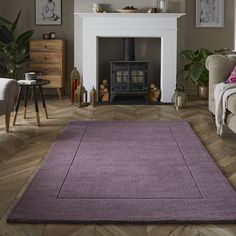 a living room filled with furniture and a fire place