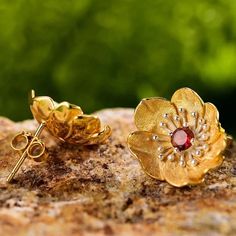 "Embrace the enchanting allure of poppy flowers with our sterling silver and gold stud earrings, each adorned with a vibrant gemstone center in your choice of blue topaz, garnet, peridot, or amethyst. 🌺💎 Crafted with meticulous detail, these earrings capture the delicate beauty of poppies in bloom, symbolizing beauty, remembrance, and vitality. Add a touch of elegance and personal flair to your ensemble with these exquisite studs, perfect for expressing your unique style and personality." 🌿✨ Flower Model, Mystic Quartz, Poppy Flowers, Delicate Beauty, Pattern Flower, Gold Stud Earrings, Citrine Crystal, Brooch Jewelry, Earring Type