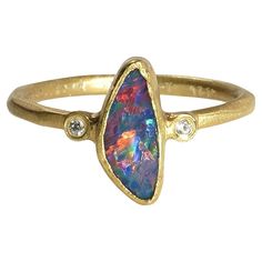 Striking, 1.08ct Freeform Australian Boulder Opal Ring with Diamonds, 24K Yellow, Solid Gold. One of a Kind Ring. This piece would make a great stacker ring with other dainty pieces paired next to it.   The opal rings in the gallery could also make incredible bridesmaids gifts. Find more exquisite, high quality, opal jewelry in the gallery Details: Diamonds: 0.02ct Opal: 1.08ct.  This opal is one of a kind making this ring, one of a kind. Size: 7 (US) Total weight: 3.35 grams About Opal: In anci The Gift Of Prophecy, Boulder Opal Ring, Mexican Opal, Big Jewelry, Stacker Rings, Australian Boulder Opal, Opal Ring, Boulder Opal, October Birth Stone