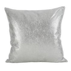 a silver pillow on a white background