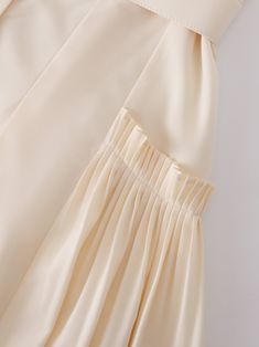 This Pintuck Pocket Skirt in Ivory is the perfect addition to any wardrobe. The unique pintuck detailing adds texture and sophistication to the classic A-line silhouette. Spring Silk Skirt With Pleated Waist, Chic Silk Skirt With Ruffles, Chic Silk Skirt With Accordion Pleats, Chic Pleated Ruffled Flowy Skirt, Feminine Cream Mini Skirt, Cream Pleated Tiered Skirt, Feminine Cream Pleated Skirt, Feminine Cream Flared Skirt, Feminine Long Skirt Beige Dress