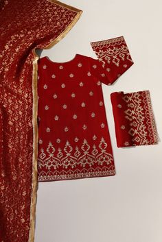 Maroon pure raw silk 58 gms embellished with zari and clusters of sequins on a short length kameez with hand/Ada buttons on neckline, styled with flappers and pure banarsi chiffon dupatta. The length of the Kameez is 36 inches. ( Shade number 4343 ) Order Duration: 4 to 6 weeks Red Dola Silk Kurta With Sheer Dupatta, Festive Sharara With Mirror Work In Nida, Festive Nida Sharara With Mirror Work, Red Raw Silk Salwar Kameez With Mirror Work, Festive Jamawar Kurta With Mirror Work, Festive Chinon Straight Kurta, Red Salwar Kameez With Mirror Work In Dola Silk, Designer Red Unstitched Suit With Mirror Work, Festive Kurta With Mirror Work In Fabric