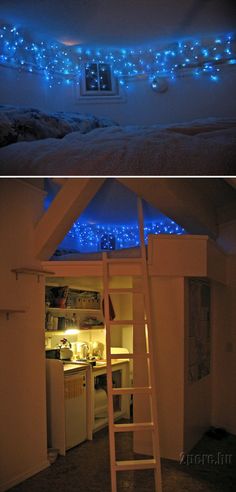 there is a loft bed with blue lights on the ceiling and below it are two pictures