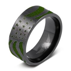 a ring with an american flag design on the inside and green inlays to it