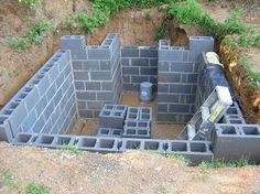 a cinder block structure with bricks in the middle