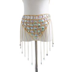 Introducing the Glam Tassel Chain Set - a dazzling and trendy two-piece outfit designed for fashion-forward women. This set is perfect for festivals, parties, or any occasion where you want to stand out in style. Featuring a stunning chain crop top, this set is adorned with crystal sequins and handmade patchwork for a unique and eye-catching look. The metal tassel chains add a touch of glamour and movement, creating a mesmerizing effect as you dance the night away. Crafted with attention to deta Trendy Festival Body Jewelry With Chain, Trendy Chain Body Jewelry For Festival, Silver Body Chain For Summer Night Out, Silver Body Chain For Night Out In Summer, Glamorous Crystal Body Jewelry For Festivals, Glamorous Festival Body Jewelry With Crystal, Glamorous Festival Crystal Body Jewelry, Glamorous Festival Body Jewelry In Crystal, Beaded Body Chain For Summer Festivals