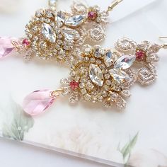 Chandelier statement wedding earrings. Hand embroidered with rhinestone on Venice lace, topped with lovely crystals. Earrings are very light and comfortable to wear, you can order matching bracelet and hair pins (separately). You can as well order earrings in other rhinestone crystals. This earrings will be shipped nicely packed in the gift box. For other wedding jewelry visit my shop; https://www.etsy.com/shop/byPiLLowDesign Gold Chandelier Earrings With Crystals For Wedding, Gold Crystal Chandelier Earrings For Wedding, Crystal Jeweled Bridal Earrings For Wedding, Glamorous Crystal Earrings For Weddings, Elegant Pink Crystal Bridal Earrings, Glamorous Jeweled Wedding Earrings, Glamorous Rhinestone Bridal Earrings For Wedding, Wedding Cubic Zirconia Jeweled Crystal Earrings, Jeweled Chandelier Drop Earrings For Wedding