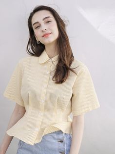 - Striped pattern- Cotton blend- Front button closure- Comfortable fit - Short length sleeves- Peplum top- Elastic band at back waistMeasurements- Length: 19.6in,  Shoulder width:15.9in,  Chest width:18.3in,  Sleeve length:9in*Model Info - Height :5’8”, Bust:32”, Waist:22”, Hip:33”Composition & Care- Outshell :65%polyester, 35%cotton- Hand-wash separately / Dry cleaning / Please check the care label. Designer- Made in Korea- by BIBYSEOB- Style#:300681267 Classic Yellow Short Sleeve Tops, Fitted Yellow Tops With Buttons, Korea Casual Outfit, Classic Yellow Blouse, Classic Yellow Summer Blouse, Classic Yellow Blouse For Spring, Yellow Fitted Button-up Tops, Classic Yellow Button-up Tops, Yellow Button-up Tops For Spring