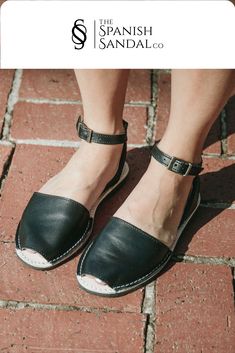 Our classic style sandal with a detachable ankle strap. They are made with black Napa leather and the outsoles are made with rubber.  #anklestrap #flats #sandals #leather #black #avarca #weekendstyle #comfyshoes #casualfriday #spanishsandal #slipon #wedges Everyday Sandals With Buckle Closure And Flat Heel, Everyday Flat Heel Sandals With Buckle Closure, Flat Sandals With Leather Sole For Everyday, Flat Sandals With Buckle Closure For Everyday, Spring Open Toe Everyday Flats, Spring Everyday Open Toe Flats, Summer Ankle Strap Flats With Buckle Closure, Leather Sandals With Flat Heel For Day Out, Chic Everyday Sandals With Leather Footbed