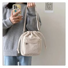 SPECIFICATIONSCN: ZhejiangBrand Name: PZKExterior: Solid BagModel Number: LE025Interior: Interior Zipper PocketShape: Casual ToteStyle: CasualPlace Of Origin: ZHE JIANG ProvincePlace Of Origin: ZHE JIANG ProvinceDecoration: noneOrigin: Mainland ChinaOccasion: VersatilePattern Type: SolidLining Material: POLYESTERMain Material: CorduroyClosure Type: stringCN: HebeiGender: WOMENHardness: SOFTsemi_Choice: yes Casual Large Capacity Drawstring Shoulder Bag, Casual Large Capacity Shoulder Drawstring Bag, Casual Canvas Satchel Bag For Daily Life, Casual Canvas Mobile Phone Bag For Daily Use, Casual Canvas Mobile Phone Bag, Casual Canvas Shoulder Bag For Daily Use, Beige Casual Canvas Bag For Daily Use, Casual Beige Canvas Bag For Daily Use, Everyday White Hobo Bag With Phone Pocket