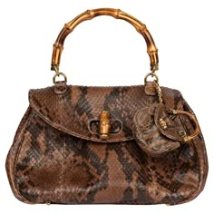 Gucci Brown Python Leather Vintage Large Classic Bamboo Top Handle With Micro Charm Brand- Gucci Model- Large Classic Bamboo Top Handle Product Type- Top Handle Serial Number- 19*********** Accompanied By- Gucci Dust Bag, Micro Charm Colour-Brown Hardware- Gold Material(s)- Python Leather Authenticity Details- Serial Stamp Height- 23cm Width- 40cm Depth- 16cm Handle Drop- 14cm Interior- Brown Suede Closure- Turn Lock Country of Origin- Italy CITES/Export Restrictions- Please note, this item may Unique Designer Bags, Gucci Top Handle Bag, Female Bags, Chic Closet, Gucci Top, My Style Bags, Snake Skin Bag, Bamboo Top, Fabric Patterns Design