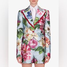 Light Blue/Multicolour Silk-Blend Floral-Print Spencer Jacket From Dolce & Gabbana Featuring All-Over Floral Print, Wide Peak Lapels, Long Sleeves, Two Side Flap Pockets And Front Button Fastening. Made In Italy Composition Blazer Silk 98%, Polyester 2% Shorts 100% Silk Luxury Silk Suits For Spring, Elegant Multicolor Floral Print Outerwear, Multicolor Long Sleeve Suits For Spring, Fitted Multicolor Suits For Spring, Tailored Floral Print Spring Outerwear, Tailored Floral Print Outerwear For Spring, Elegant Blue Floral Print Outerwear, Shantung Silk, Spencer Jacket